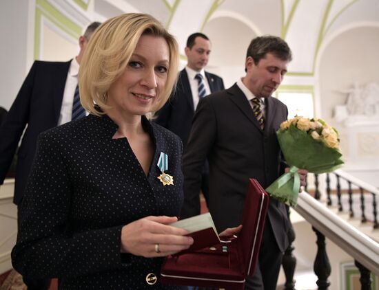 Russian President Vladimir Putin presents state decorations