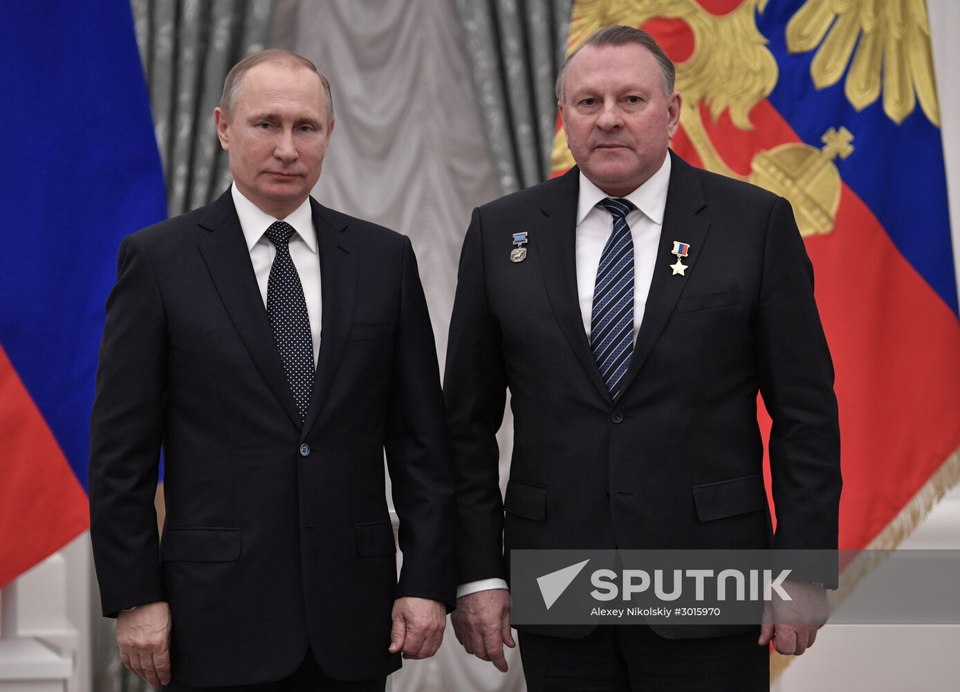 Russian President Vladimir Putin presents state decorations