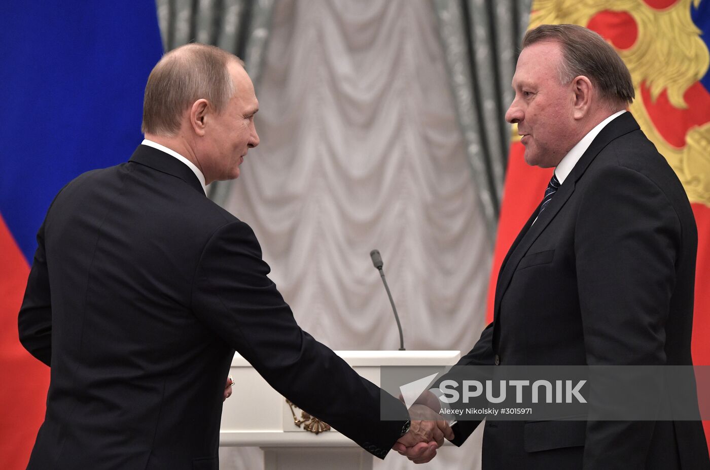 Russian President Vladimir Putin presents state decorations