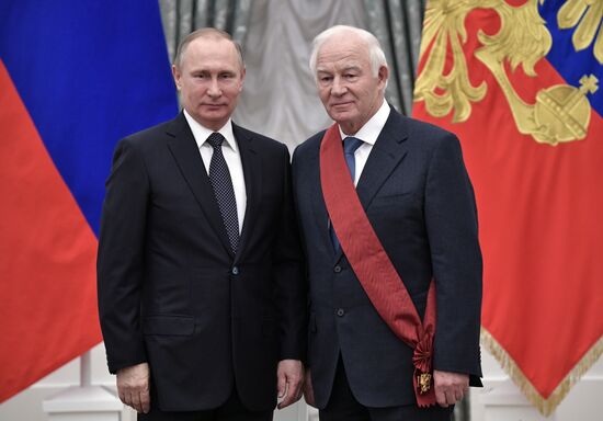Russian President Vladimir Putin presents state decorations