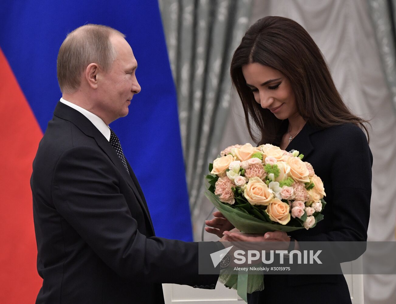 Russian President Vladimir Putin presents state decorations