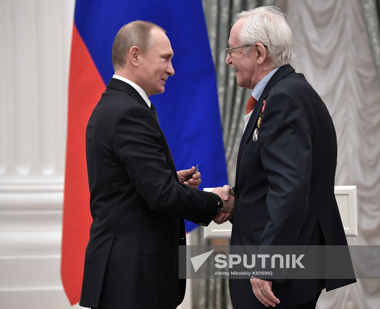 Russian President Vladimir Putin presents state decorations