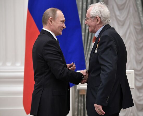 Russian President Vladimir Putin presents state decorations