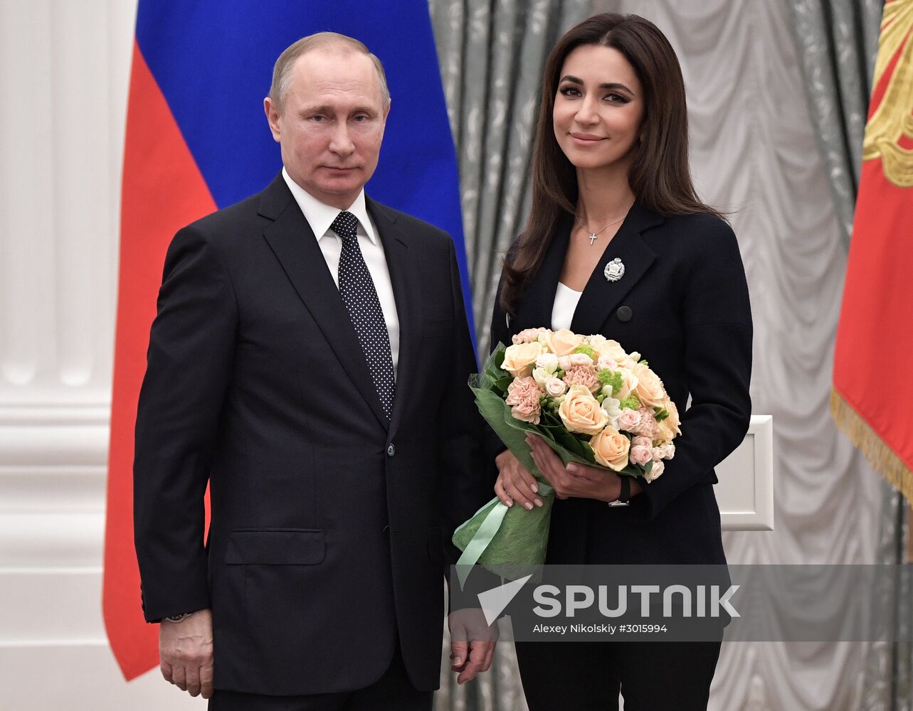 Russian President Vladimir Putin presents state decorations
