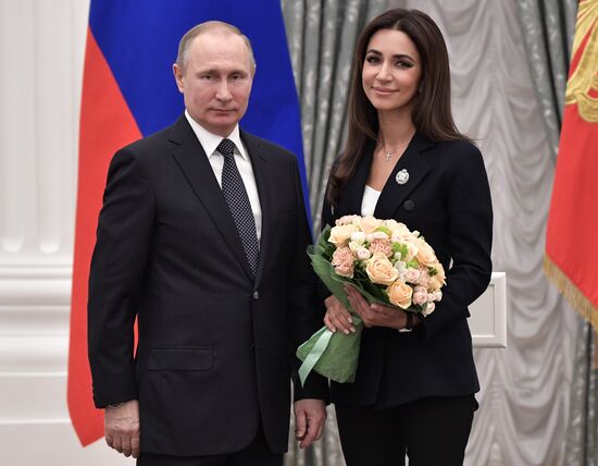 Russian President Vladimir Putin presents state decorations