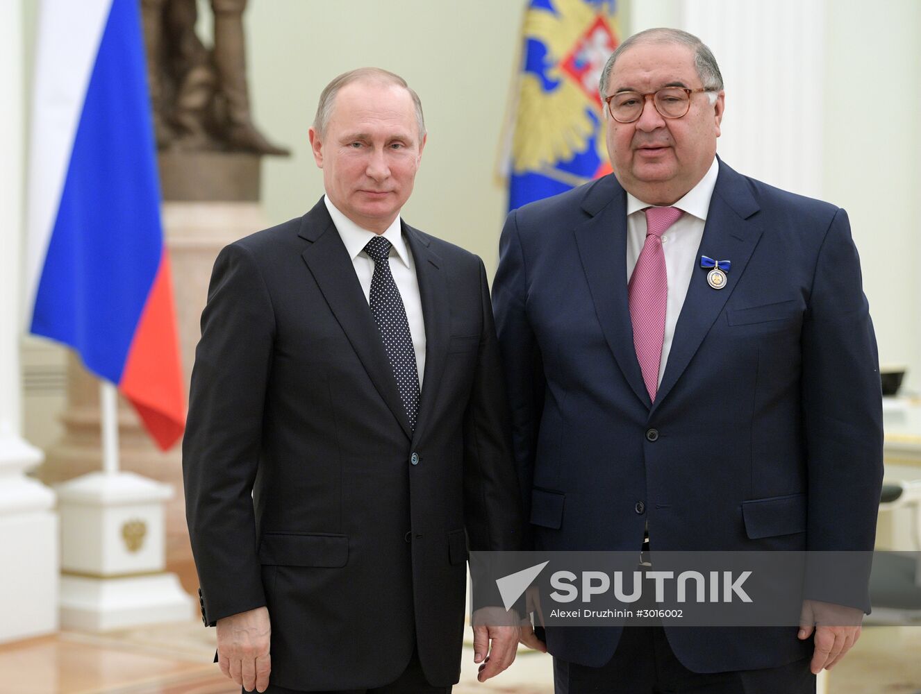 Russian President Vladimir Putin presents state decorations