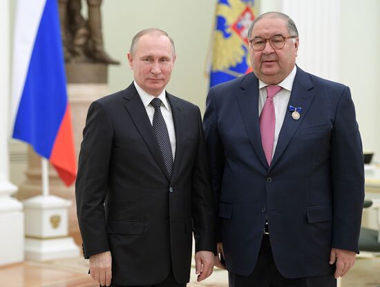 Russian President Vladimir Putin presents state decorations