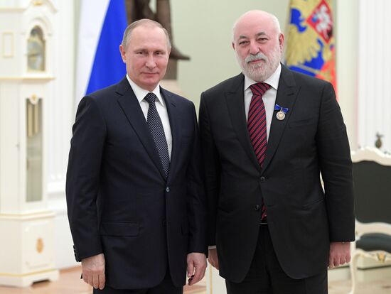 Russian President Vladimir Putin presents state decorations