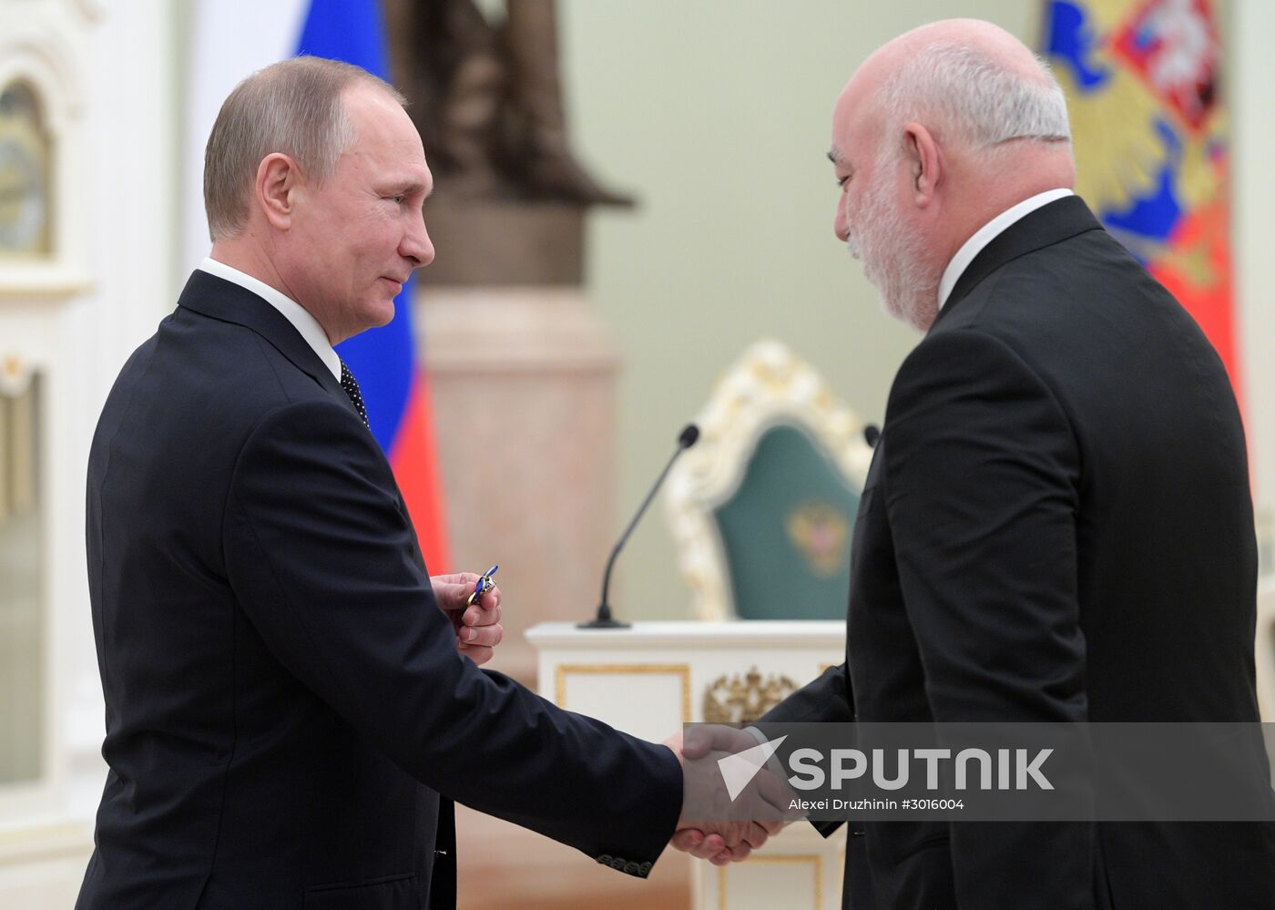 Russian President Vladimir Putin presents state decorations