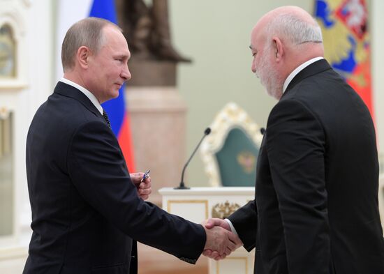 Russian President Vladimir Putin presents state decorations