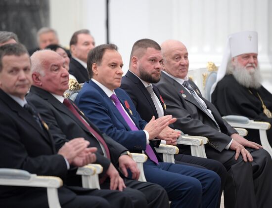 Russian President Vladimir Putin presents state decorations