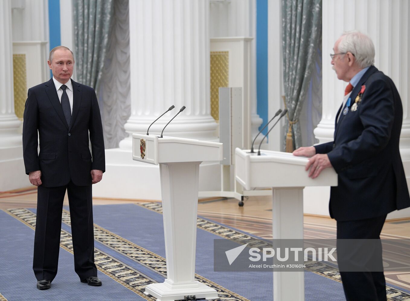 Russian President Vladimir Putin presents state decorations