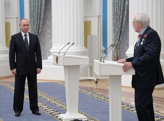 Russian President Vladimir Putin presents state decorations