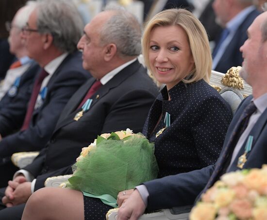 Russian President Vladimir Putin presents state decorations