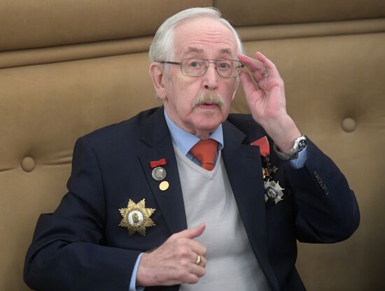 Russian President Vladimir Putin presents state decorations