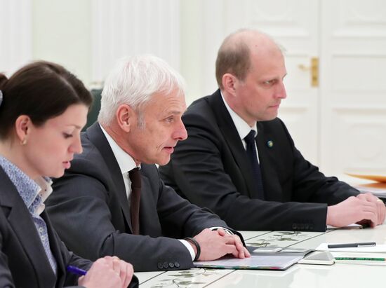 President Vladimir Putin meets with Volkswagen AG Management Board Chair Matthias Müller