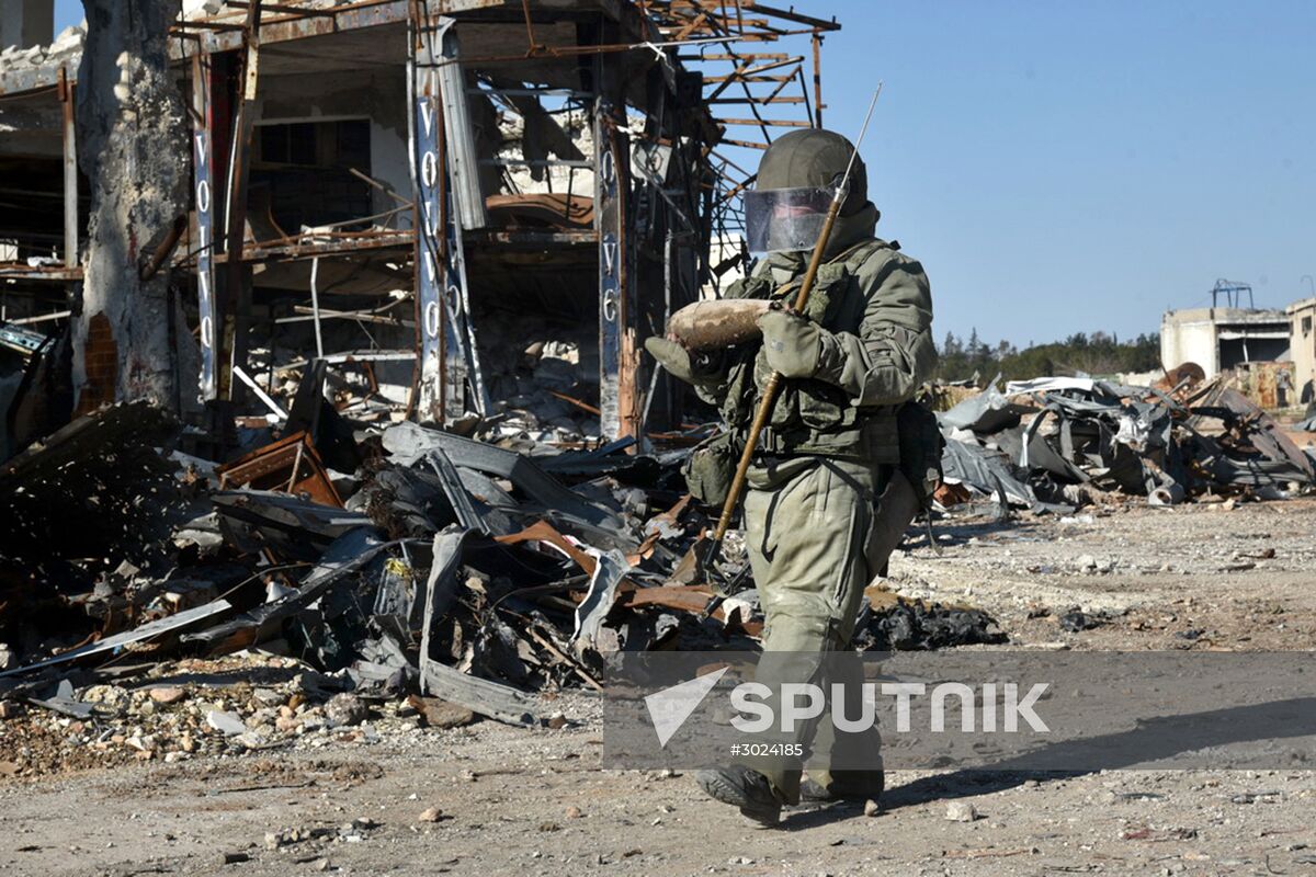 Russian Army Mine Action Center sappers inspect ruined buildings in Aleppo
