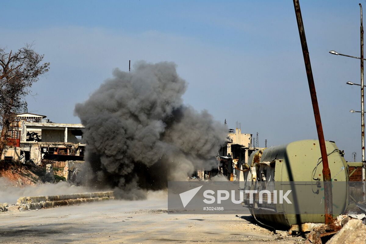 The Russian Armed Force Mine Action Centre sappers inspect ruined buildings in Aleppo