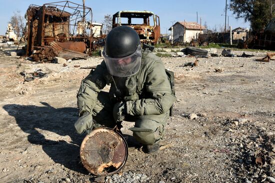 Russian Armed Force Mine Action Centre sappers inspect ruined buildings in Aleppo