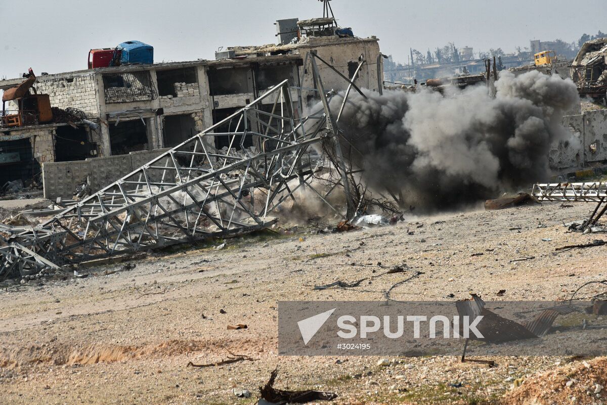 The Russian Armed Force Mine Action Centre sappers inspect ruined buildings in Aleppo