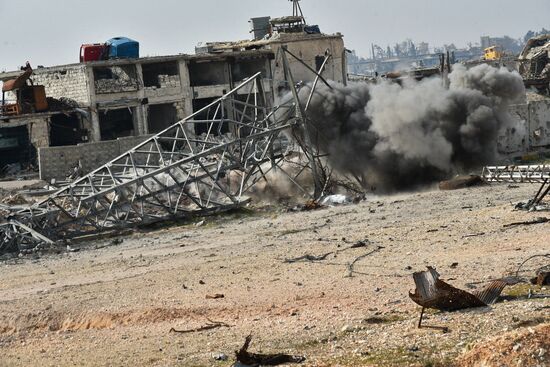 The Russian Armed Force Mine Action Centre sappers inspect ruined buildings in Aleppo