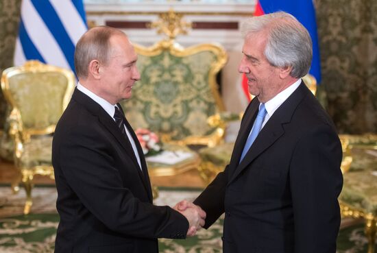 Russian President Vladimir Putin meets with President of Uruguay Tabare Vazquez