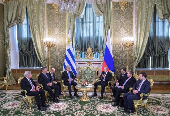 Russian President Vladimir Putin meets with President of Uruguay Tabaré Vazquez