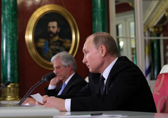 Russian President Vladimir Putin meets with President of Uruguay Tabaré Vazquez