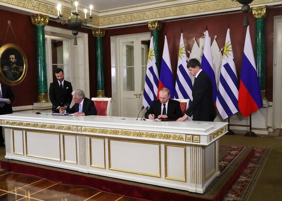 Russian President Vladimir Putin meets with President of Uruguay Tabaré Vazquez