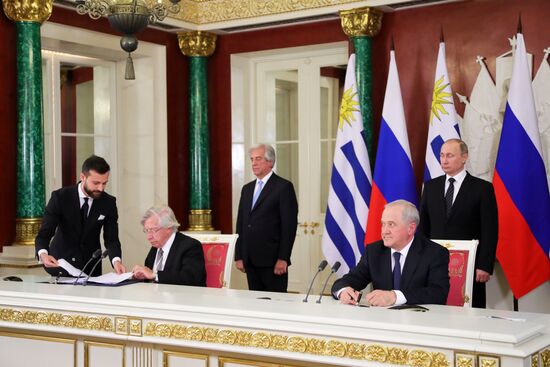 Russian President Vladimir Putin meets with President of Uruguay Tabaré Vazquez