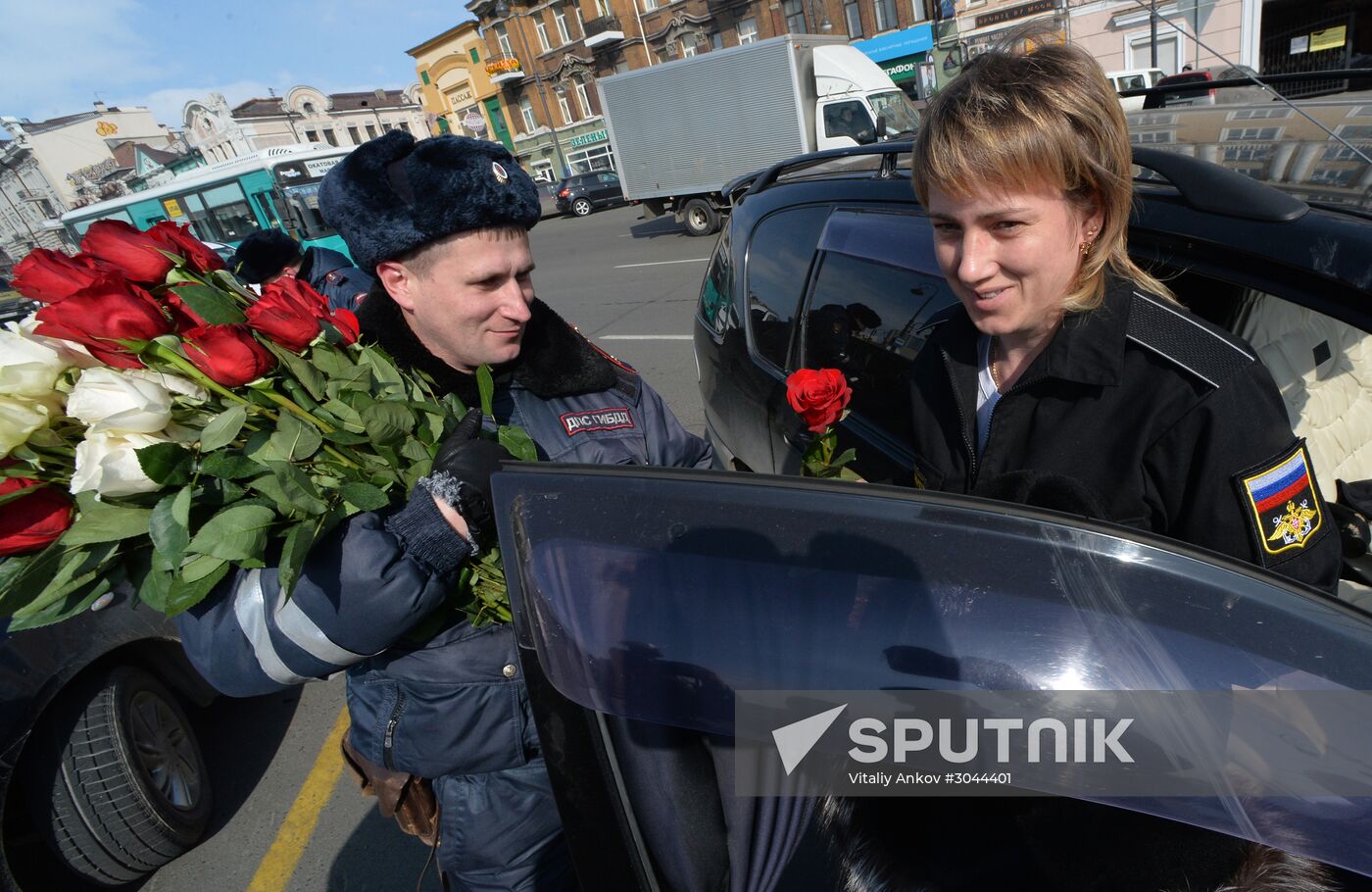 Traffic police officers congratulate women in the run-up to March 8