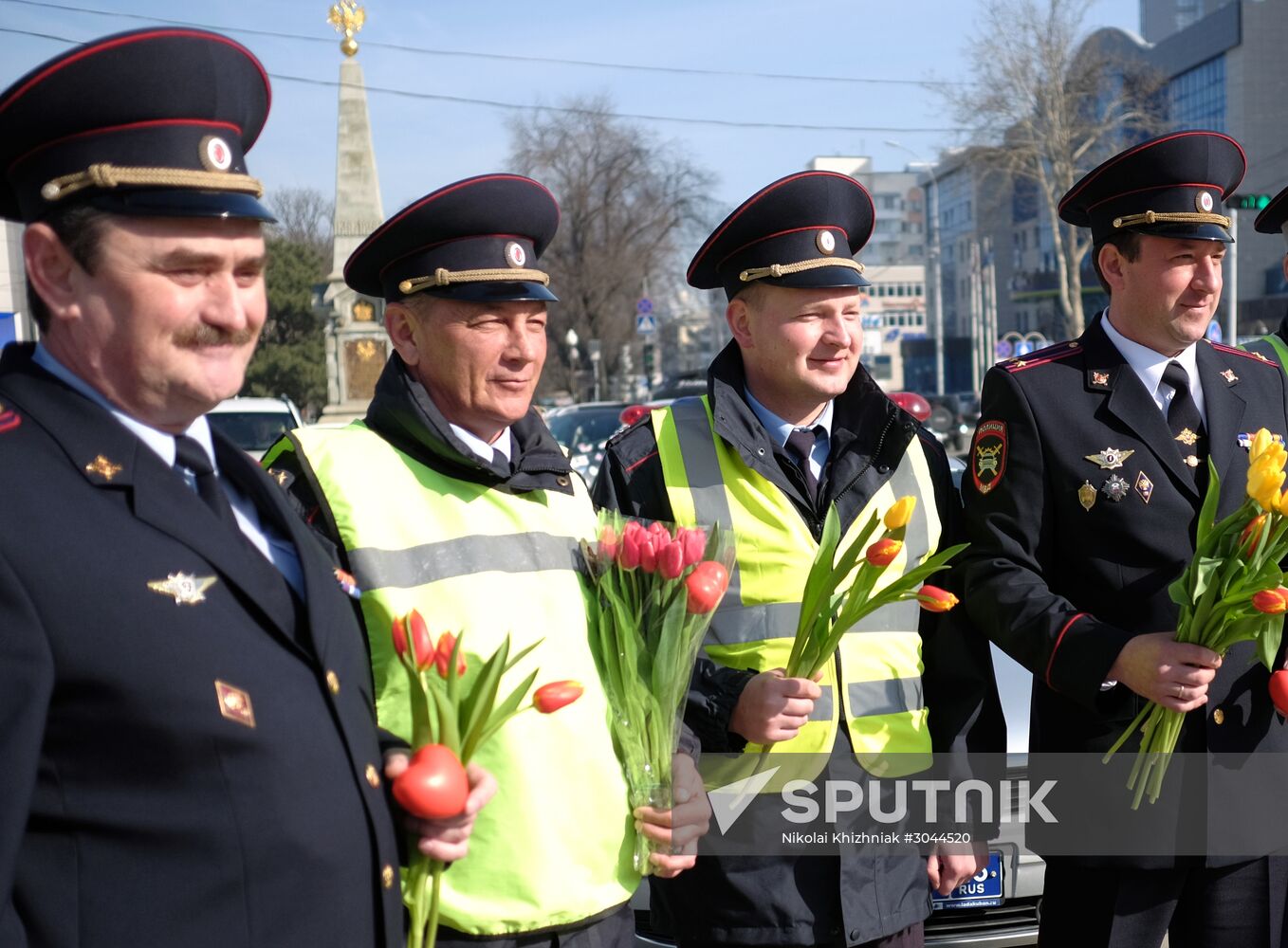 Traffic police officers congratulate women in the run-up to March 8