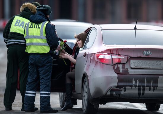 Traffic police officers wish women a happy March 8