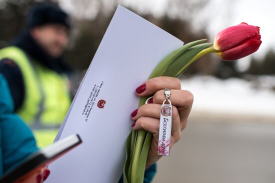 Traffic police officers wish women a happy March 8