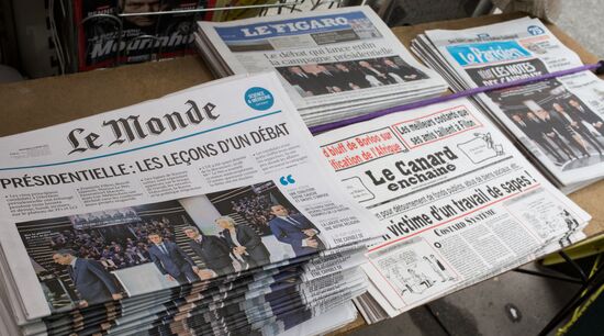 Front pages of French newspapers covering presidential debate