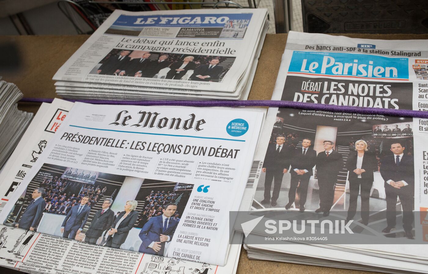Front pages of French newspapers covering presidential debate