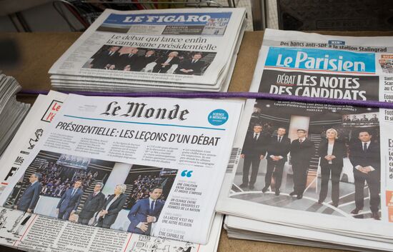 Front pages of French newspapers covering presidential debate