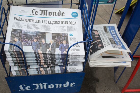 Front pages of French newspapers covering presidential debate