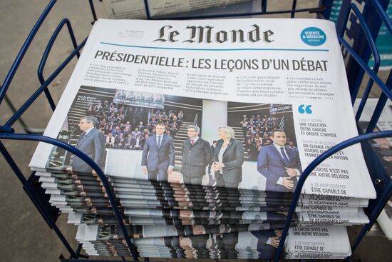 Front pages of French newspapers covering presidential debate