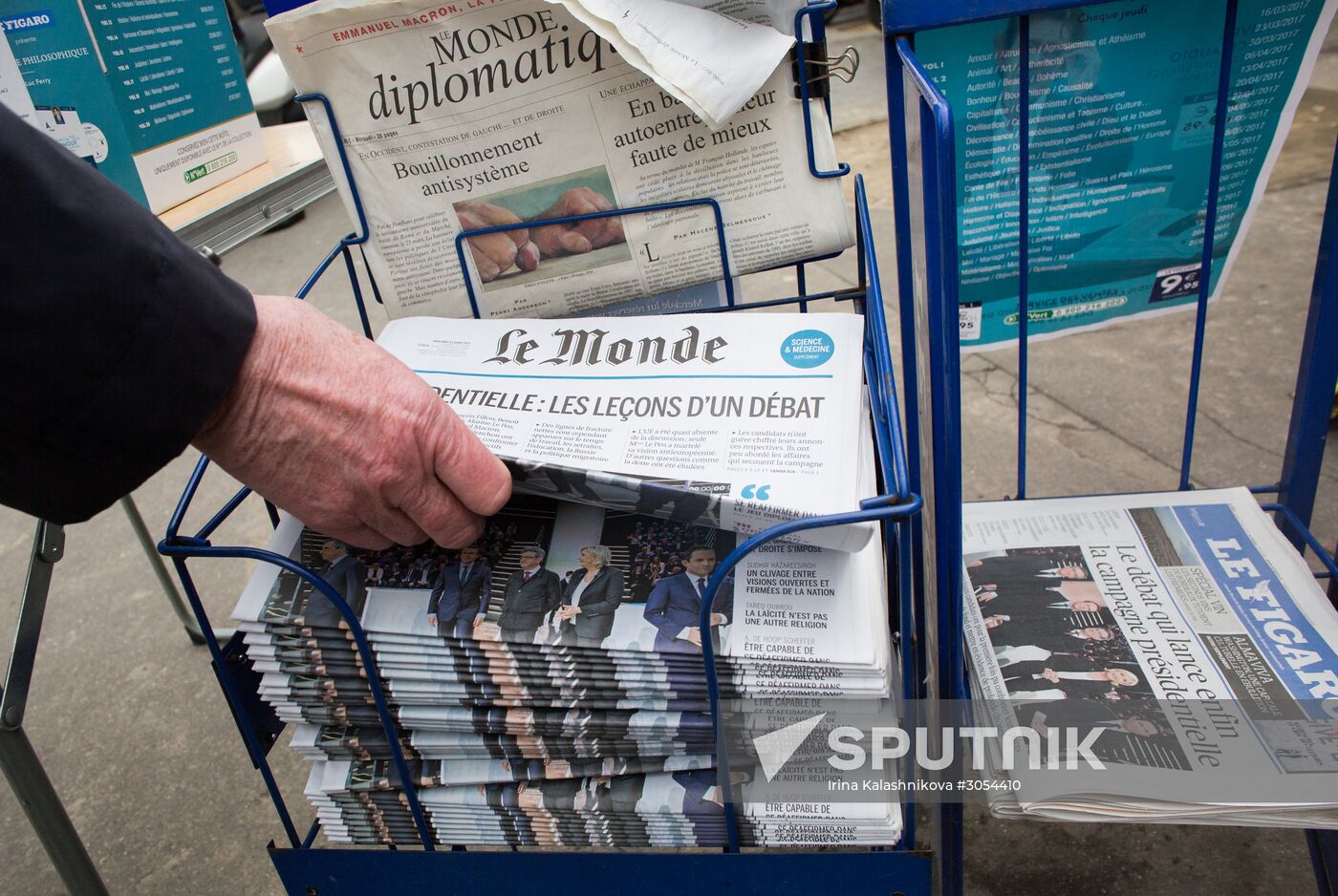 Front pages of French newspapers covering presidential debate