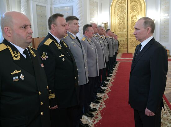 Russian President Vladimir Putin meets with senior officers awarded top special military ranks