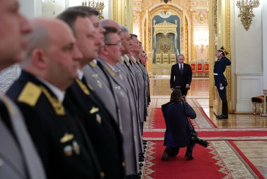 Russian President Vladimir Putin meets with senior officers awarded top special military ranks