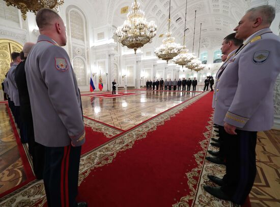 Russian President Vladimir Putin meets with senior officers awarded top special military ranks