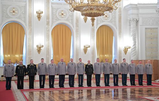 Russian President Vladimir Putin meets with senior officers awarded top special military ranks