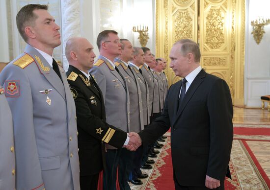 Russian President Vladimir Putin meets with senior officers awarded top special military ranks