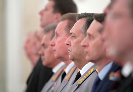 Russian President Vladimir Putin meets with senior officers awarded top special military ranks