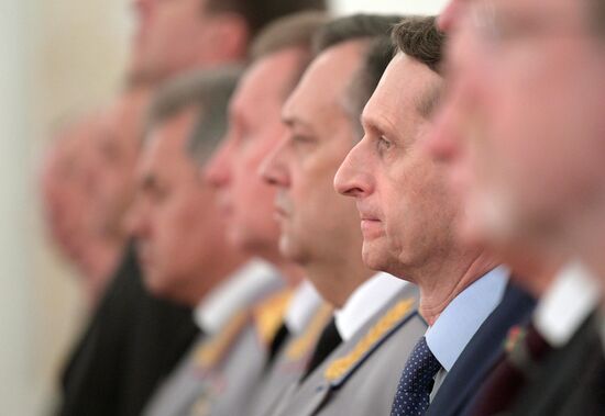 Russian President Vladimir Putin meets with senior officers awarded top special military ranks