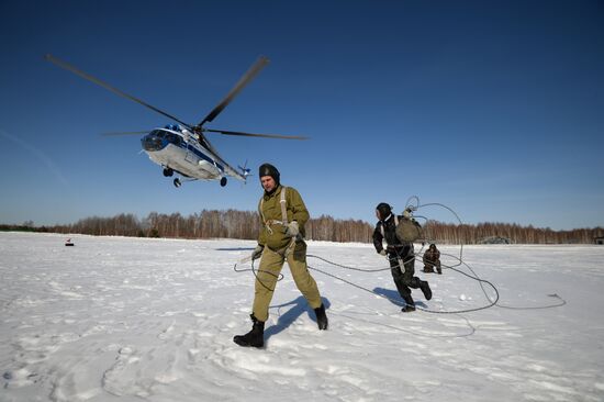 Drill of Novosibirsk air base's parachute fire service members