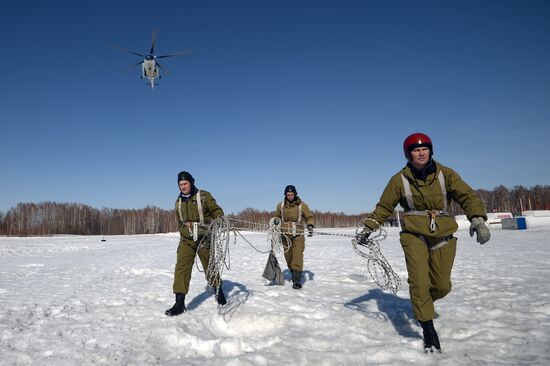 Drill of Novosibirsk air base's parachute fire service members