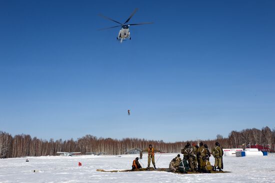 Drill of Novosibirsk air base's parachute fire service members